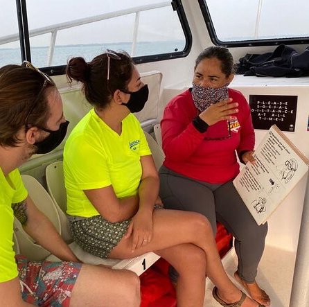 Scuba diver exploring underwater with vibrant coral reef at Splash Dive Center Discover Scuba program